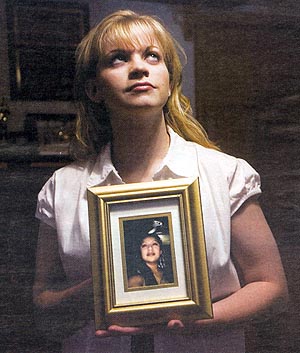 Jessica Lynch holding photo of Lori Piestews
